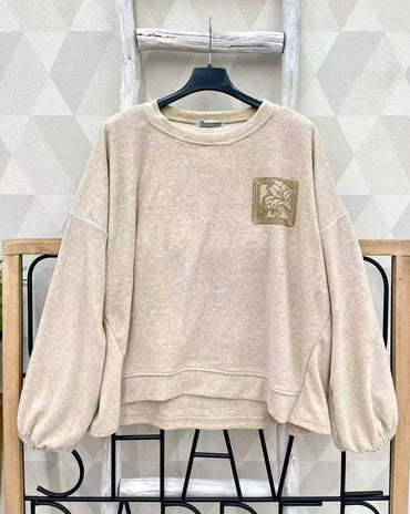 Pull avec strass doré