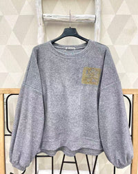 Pull avec strass doré