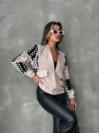 Veste à motifs beige et noire